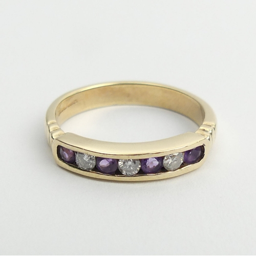 18 - 9ct gold channel set amethyst and diamond ring, 2.7 grams, 3.8mm, size M1/2.