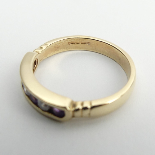 18 - 9ct gold channel set amethyst and diamond ring, 2.7 grams, 3.8mm, size M1/2.