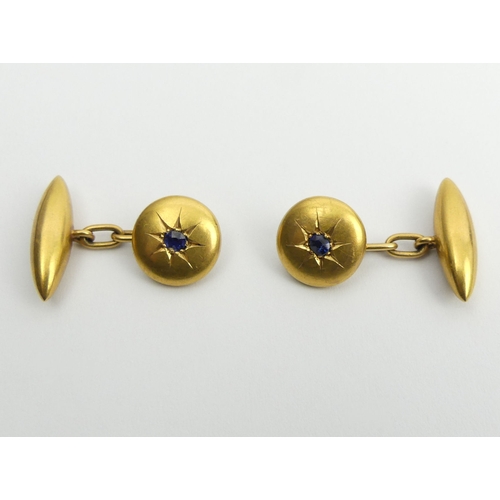 2 - A pair of 18ct gold sapphire set cufflinks, 5.4 grams, 12mm diameter.