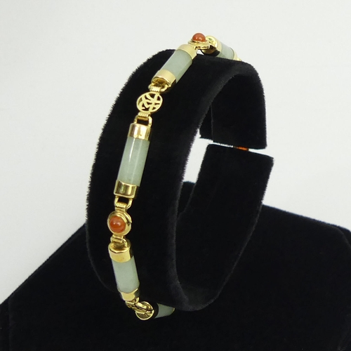 25 - 14ct gold two colour jade bracelet, 7 grams, 18.5cm.