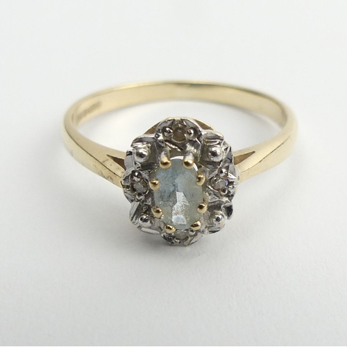 9 - 9ct gold aquamarine and diamond ring, 1.6 grams, 9mm, size L.