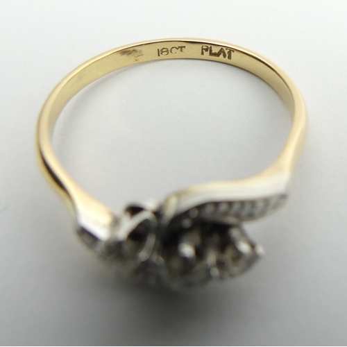 26 - 18ct gold and platinum three stone diamond ring, 3.4 grams, 7.9mm, size R.