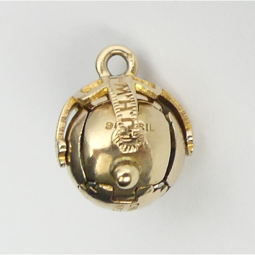 28 - 9ct gold and silver masonic ball pendant/charm/cross. 30mm x 12mm diameter.