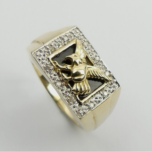 32 - Gents 9ct gold diamond set eagle design ring, 5.9 grams, 12mm, size X.