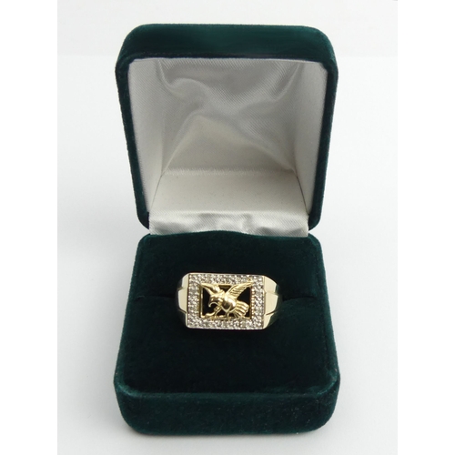 32 - Gents 9ct gold diamond set eagle design ring, 5.9 grams, 12mm, size X.