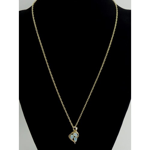 33 - 9ct gold opal pendant and chain 2.6 grams, pendant 20mm long, chain 44cm.