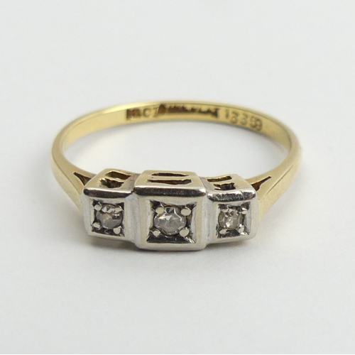 35 - 18ct gold and platinum diamond three stone ring, 2.4 grams, 4.9mm, size O.