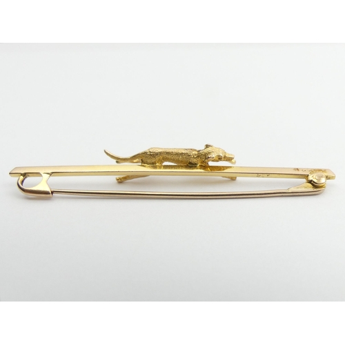 36 - 9ct gold dog design bar brooch, 3 grams, 5.5cm.