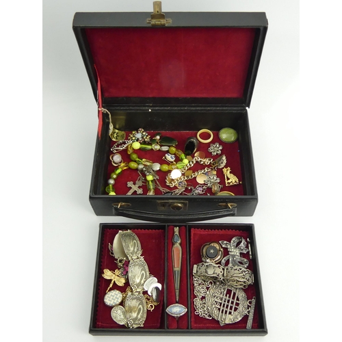 46 - An old jewellery box and contents including a Victorian enamelled locket pendant and chain.