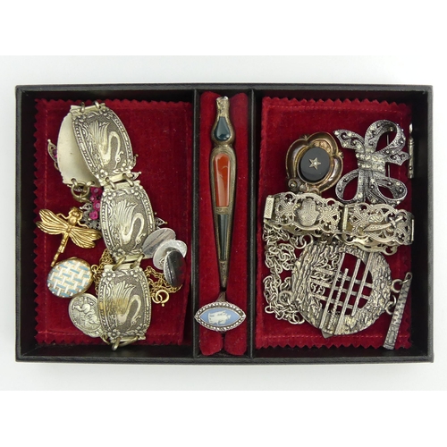 46 - An old jewellery box and contents including a Victorian enamelled locket pendant and chain.