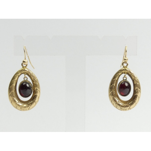 54 - A pair of 9ct gold garnet drop earrings, 7.4 grams, 30mm.