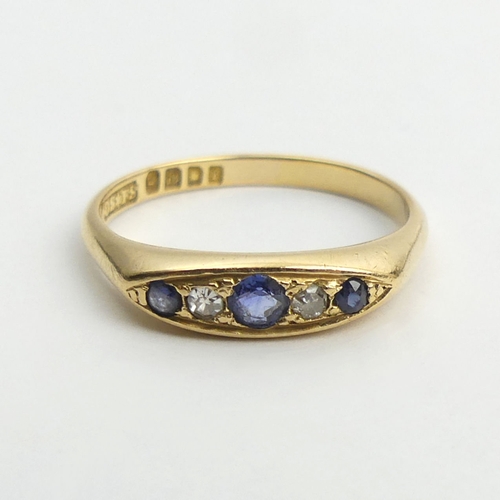 60 - George V 18ct gold sapphire and diamond ring, London 1920, 3.1 grams, 4mm, size M.