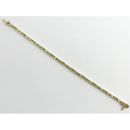 62 - 9ct gold (tested) emerald and diamond line bracelet, 9.8 grams, 18cm x 3mm.