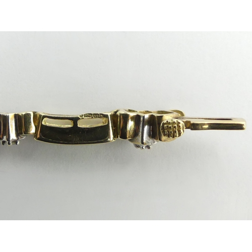 62 - 9ct gold (tested) emerald and diamond line bracelet, 9.8 grams, 18cm x 3mm.