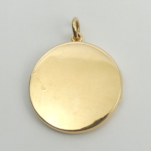 79 - 15ct gold locket pendant, 10.4 grams, 28.3mm in diameter.