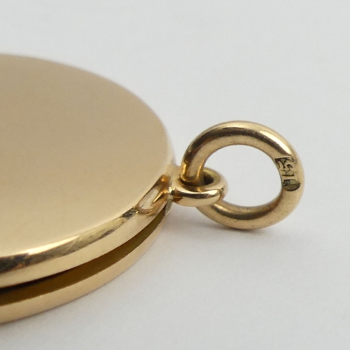 79 - 15ct gold locket pendant, 10.4 grams, 28.3mm in diameter.