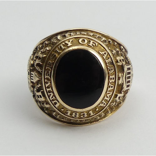 82 - 10ct gold onyx set Alabama University ring, 15.9 grams, 20mm, size R.