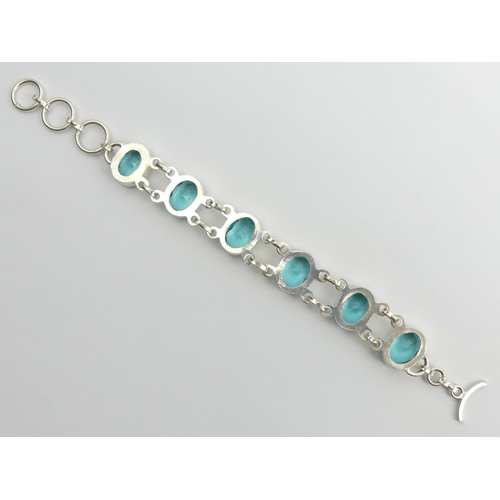 85 - Sterling silver blue stone set bracelet, 25.4 grams, 20cm x 16.2mm.