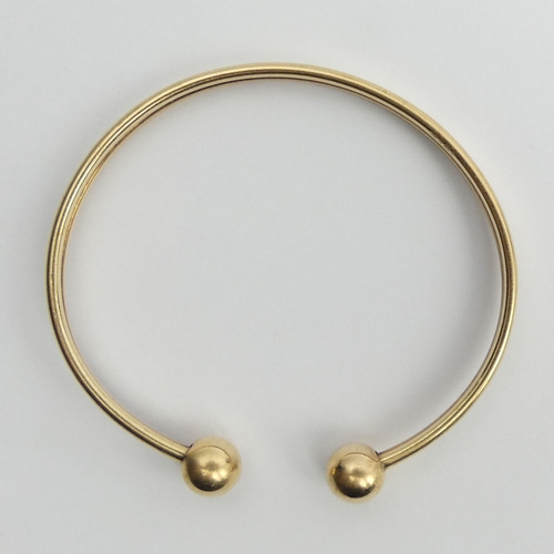 87 - 9ct gold torque type bangle, 5.3 grams, 7.7mm.