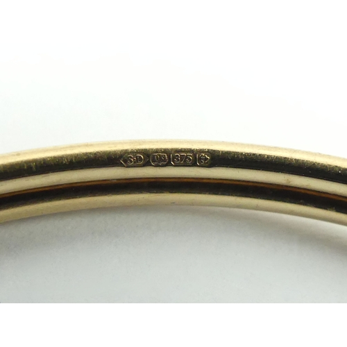 87 - 9ct gold torque type bangle, 5.3 grams, 7.7mm.