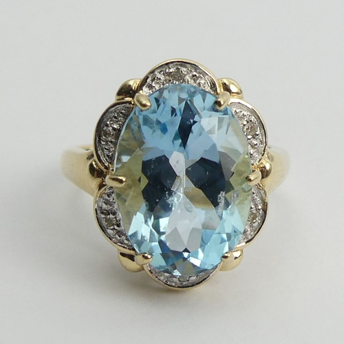 89 - 9ct gold blue topaz and diamond ring, 4.4 grams, 17.4mm, size K 1/2.