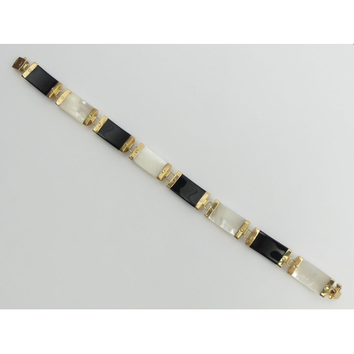 93A - 9ct gold jet and mother of pearl Chinese bracelet, 10.9 grams, 8cm x 9mm.