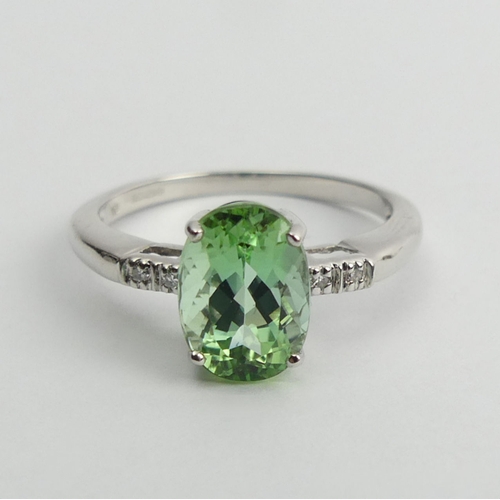 97 - 9ct white gold oval tourmaline and diamond ring, 2.4 grams, 9.3mm, size N1/2.