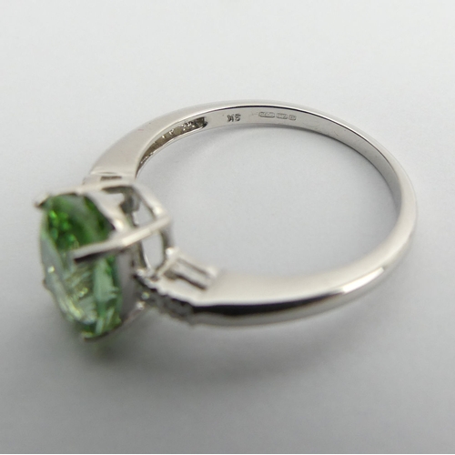 97 - 9ct white gold oval tourmaline and diamond ring, 2.4 grams, 9.3mm, size N1/2.