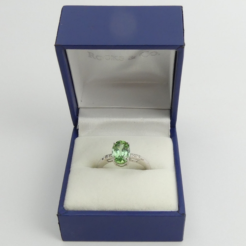 97 - 9ct white gold oval tourmaline and diamond ring, 2.4 grams, 9.3mm, size N1/2.