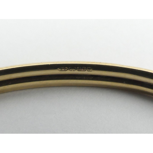 103 - 9ct gold torque bangle, 6.8 grams.