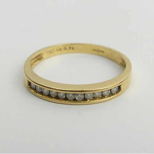 121 - 18ct gold channel set eleven stone diamond ring 2 grams, 2.8mm, size N.