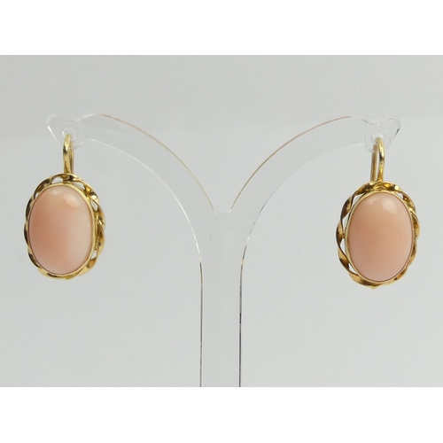 125A - A pair of 18ct gold coral set earrings, 5.7grams, 22.8mm x 12.7mm.