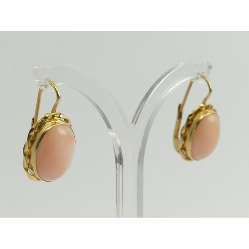 125A - A pair of 18ct gold coral set earrings, 5.7grams, 22.8mm x 12.7mm.