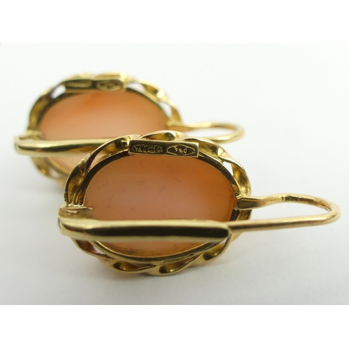 125A - A pair of 18ct gold coral set earrings, 5.7grams, 22.8mm x 12.7mm.