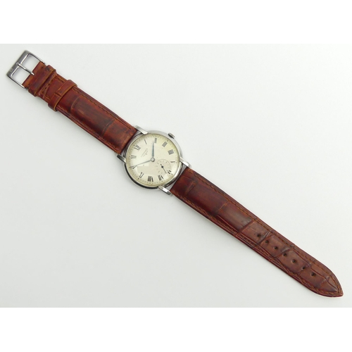 136 - Longines manual wind gents watch on a leather strap, 37.5mm inc. button.