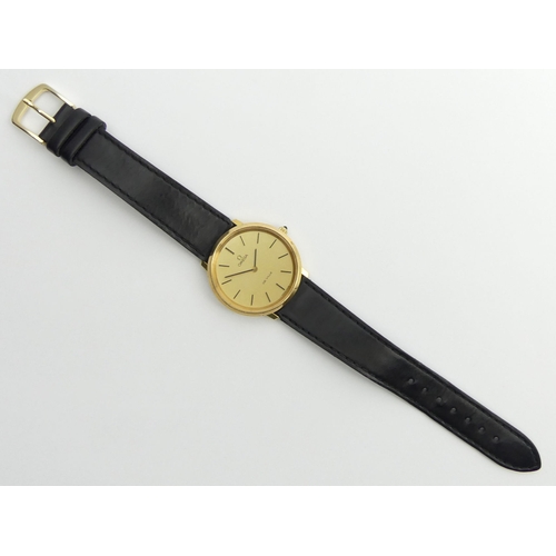 138 - Omega De Ville gold tone manual wind watch on a black leather strap, 35.3mm inc. button.
Condition R... 