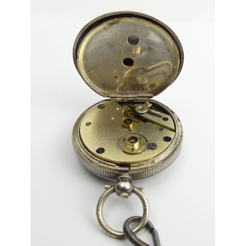 140 - Silver fancy dial pocket watch and a graduated curb link Albert chain, watch 54 x 37mm, chain 19cm.