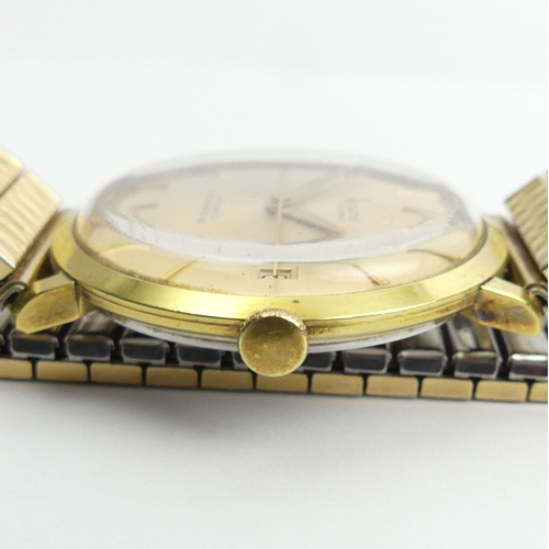 143 - Accurist gold plated 21 jewel automatic date adjust watch, 34.4mm inc. button. 
Condition Report: In... 