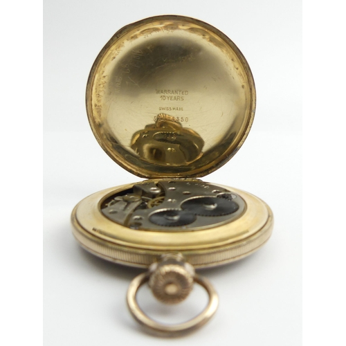 144 - Cyma gold plated open face pocket watch, 46 x 61mm. 
Condition Report: In good working order.