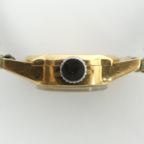 151 - 18ct gold Mudu manual wind watch, 16.5mm wide. 
Condition Report: In good working order.