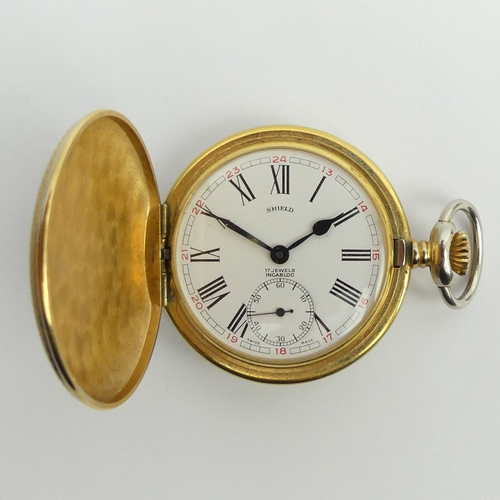 153 - Shield 17 jewel gold plated full hunter pocket watch, 47 x 62mm.
Condition Report: In working Order.