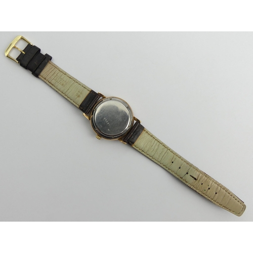 160F - Allaine 30 jewel automatic gold tone gents watch on a leather strap, 36mm wide.