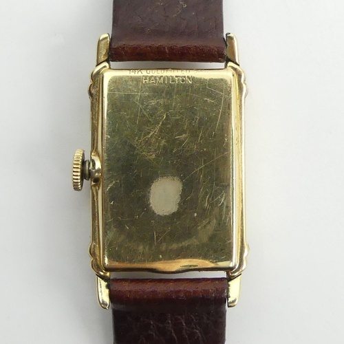 162 - Hamilton manual wind gold plated wristwatch on a leather strap, 23mm x 37mm.
Condition Report: In wo... 