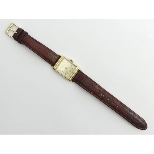 162 - Hamilton manual wind gold plated wristwatch on a leather strap, 23mm x 37mm.
Condition Report: In wo... 