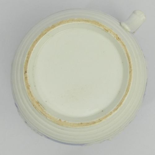 329 - Ridgway relief moulded pottery jug dating from C.1825, 12cm x 18cm.