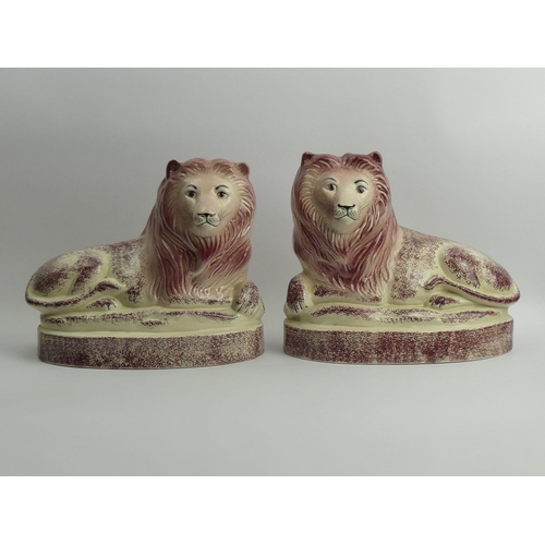 341 - A pair of large Rye pottery lion figures, 22cm x 26cm.