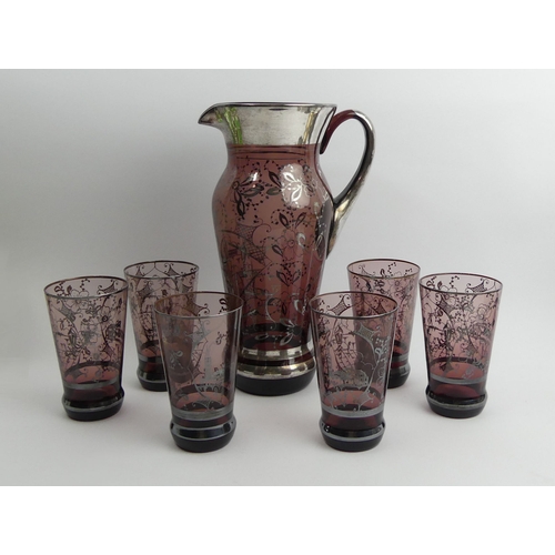 Venitian amethyst glass water jug and six glasses with silver overlay ...