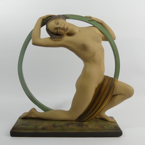 381 - Classic Art Deco plaster girl in a hoop figure, reg no 818406, 37cm high.