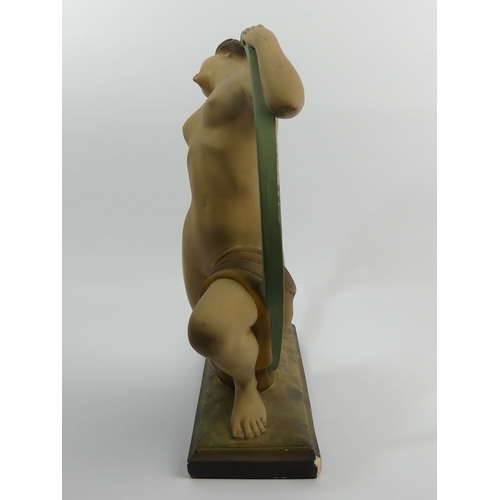 381 - Classic Art Deco plaster girl in a hoop figure, reg no 818406, 37cm high.