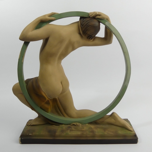 381 - Classic Art Deco plaster girl in a hoop figure, reg no 818406, 37cm high.